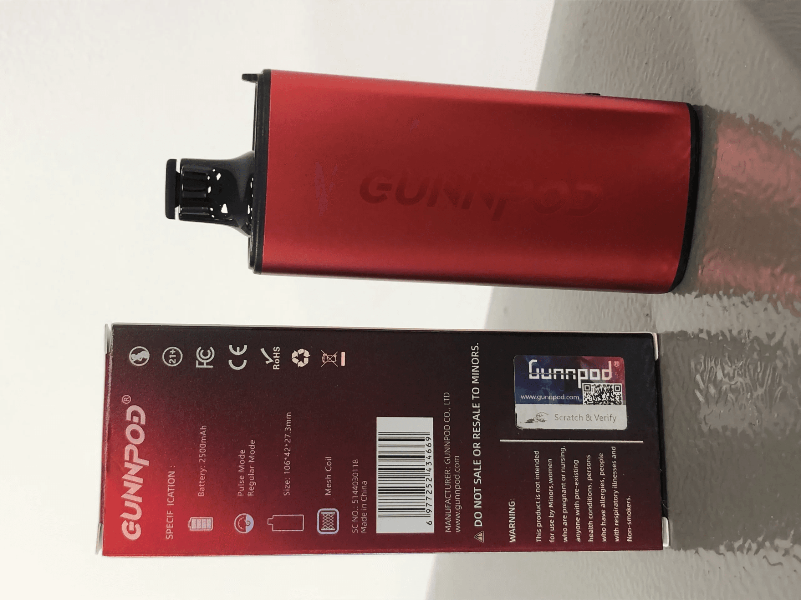 sydney vape hub device held against Sydney Harbour backdrop, early-morning light