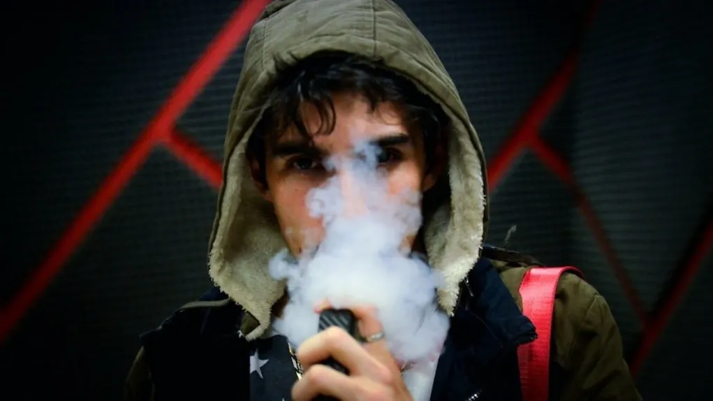 Person making an informed choice about vaping products while reading 2026 scientific research on a tablet, effects vaping australia science consumer decision